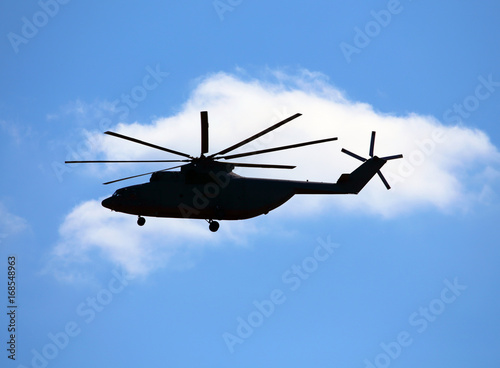 Side view of transport helicopter in flight.