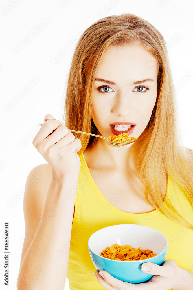 Beautiful caucasian woman eating cereals. Beautiful caucasian woman eating cereals.
