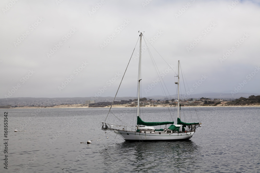 Two-Masted Wooden Sailboat Moored To Buoy Monterey California Two-Masted Wooden Sailboat Moored To Buoy Monterey California