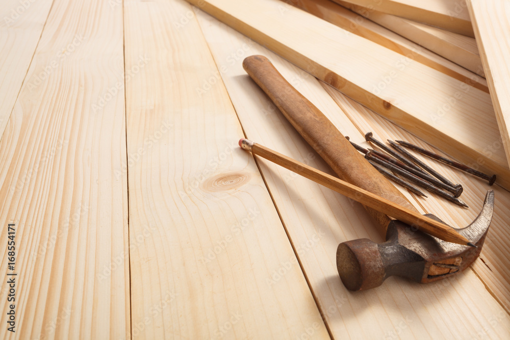 hammer and nails on wooden background, top view. Empty space for Your text