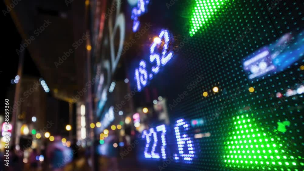 Trading Board With Street Reflections and pedestrians