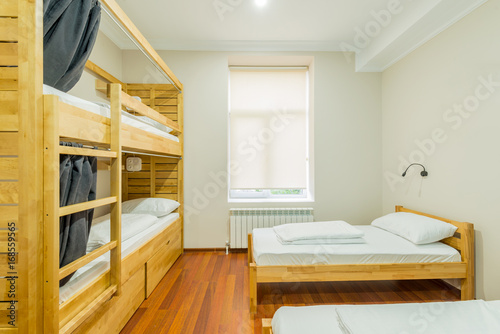 Hostel dormitory beds arranged in room