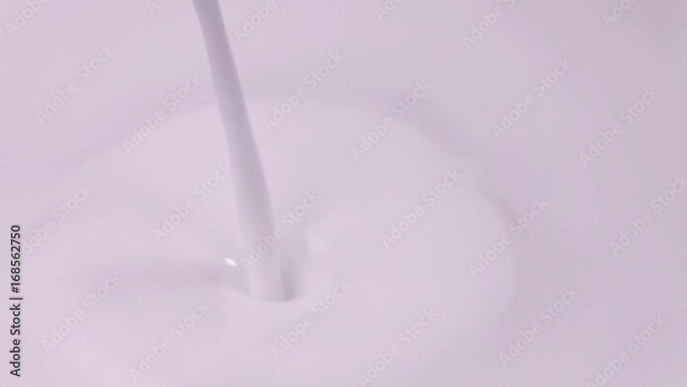 Raspberries falling into milk in slow motion. Raspberry falls into Yogurt in slow motion. Raspberries falling into milk in slow motion. Raspberry falls into Yogurt in slow motion.