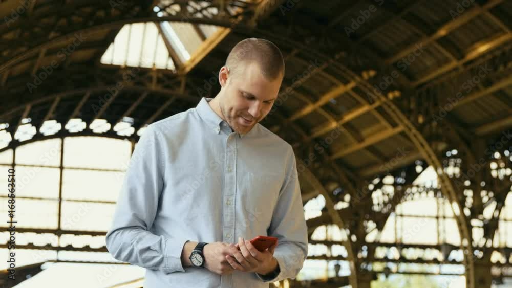 Man With Mobile Phone At Train Platform Man With Mobile Phone At Train Platform