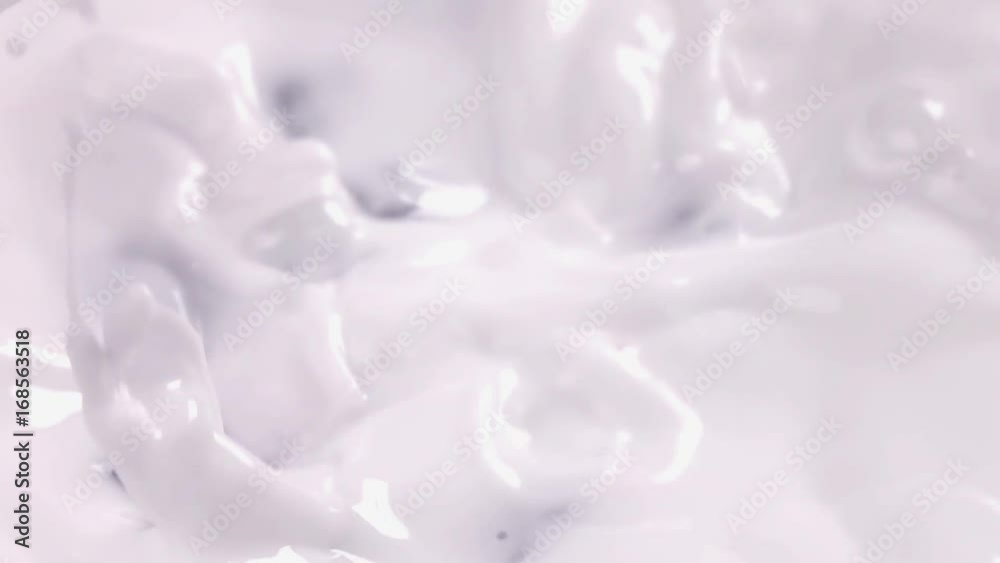 Blueberries falling into milk in slow motion. Blueberries falls into Yogurt in slow motion. Blueberries falling into milk in slow motion. Blueberries falls into Yogurt in slow motion.