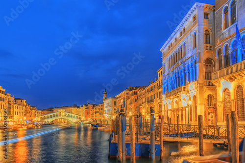 Views of the most beautiful canal of Venice - Grand Canal water streets, boats, gondolas, mansions along. Night view. Italy.