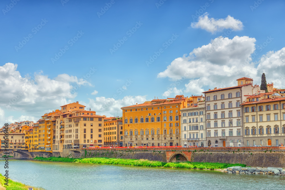 Fototapeta premium Beautiful landscape view bank of the Arno River of the Florence - the center of the Florentine Republic, the capital of the dukes of the Medici and the Italian kingdom.