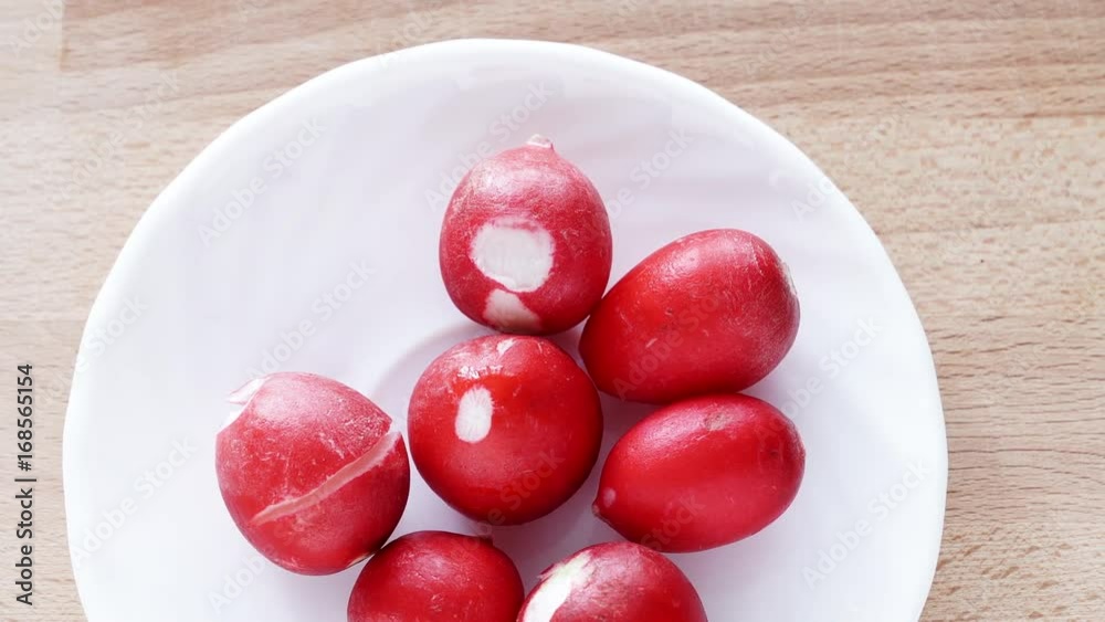 Fresh radish on plate, table background, top view. Dolly sliding shot 4K ProRes HQ codec Fresh radish on plate, table background, top view. Dolly sliding shot 4K ProRes HQ codec