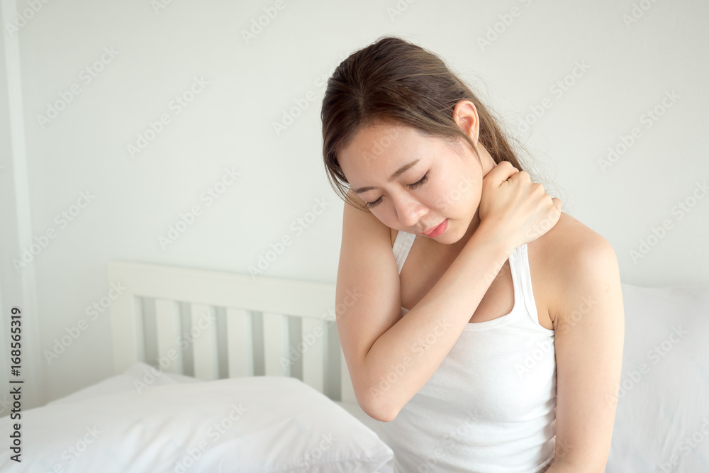 Asian woman pain at neck, feel ache, Inflammation, woman muscle pain concept Asian woman pain at neck, feel ache, Inflammation, woman muscle pain concept