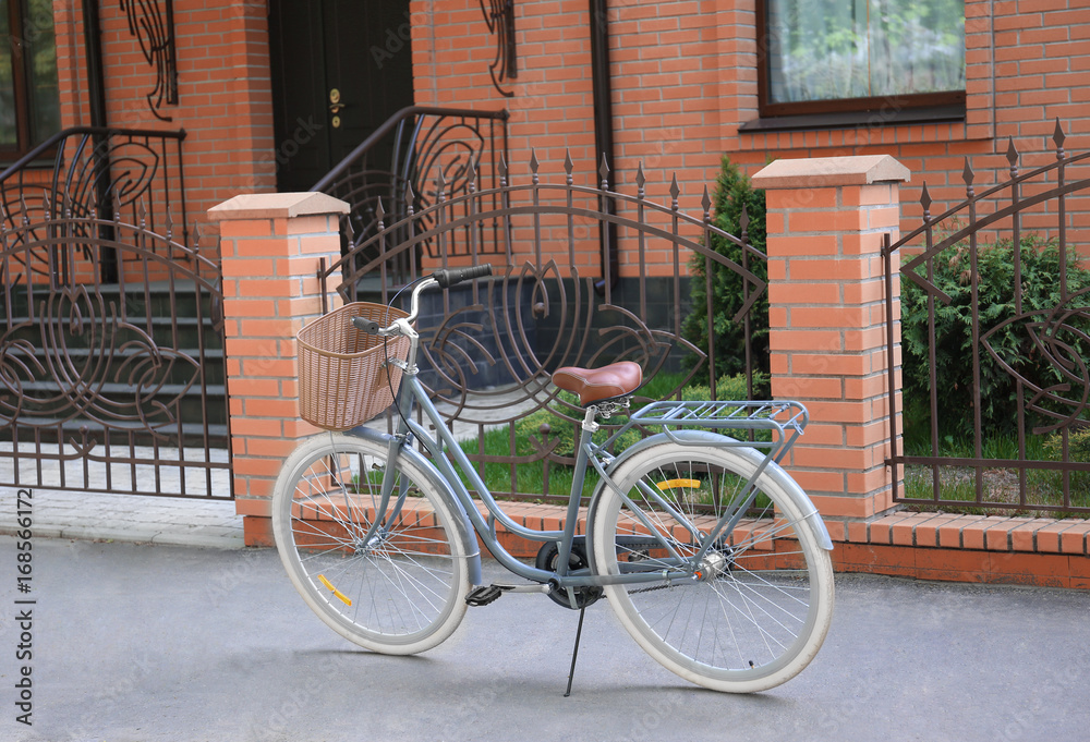Bicycle with wicker basket on street