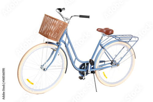 Bicycle with wicker basket on white background