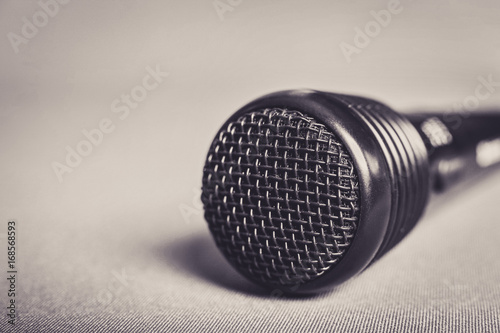 Microphone on fabric background with copy space close up