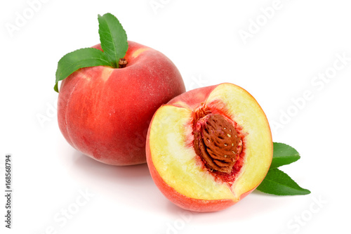 Peach and half with a green leaf isolated on white background