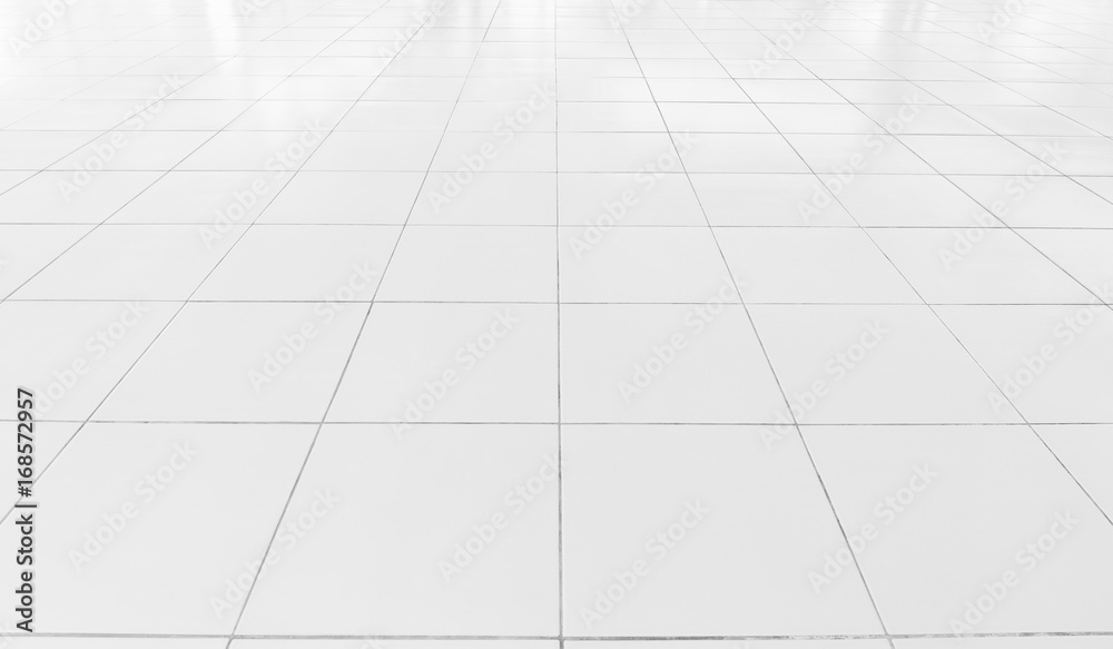 White tile floor background in perspective view. Clean, shiny, symmetry with grid line texture. For decoration in bathroom, kitchen and laundry room. And empty or copy space for product display also. White tile floor background in perspective view. Clean, shiny, symmetry with grid line texture. For decoration in bathroom, kitchen and laundry room. And empty or copy space for product display also.