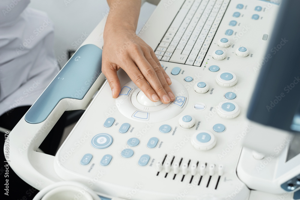 Doctor Operating Ultrasound Machine In Hospital Doctor Operating Ultrasound Machine In Hospital