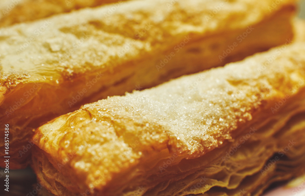 Puff pastry cakes with sugar powder close up Puff pastry cakes with sugar powder close up