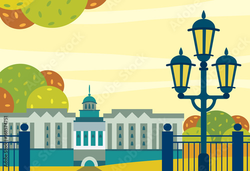 City autumn landscape - building, garden and street lighting.