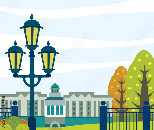 City autumn landscape - building, garden and street lighting.