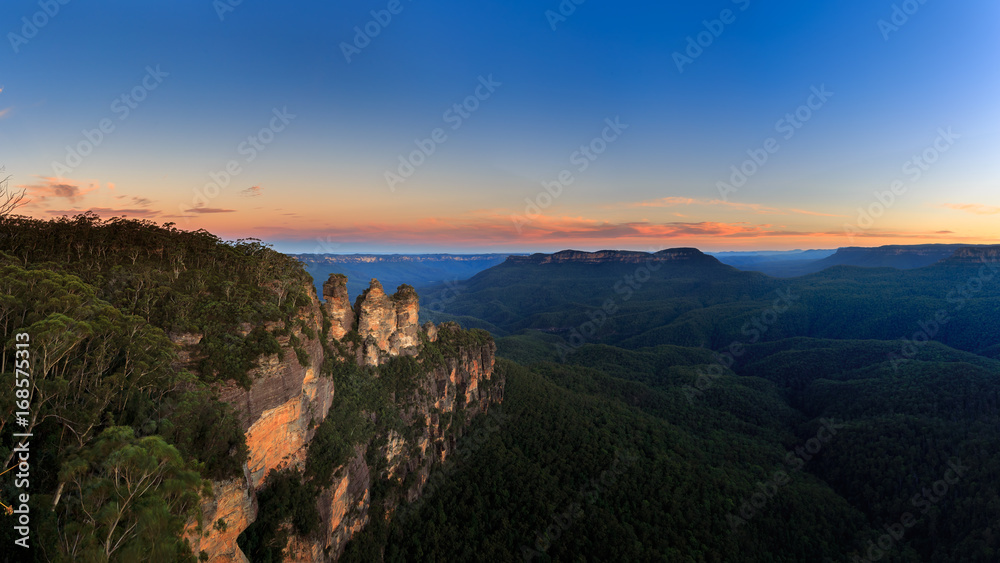 Beautiful View Panorama of the famous Three Sisters rock formation in the Blue Mountains National Park at twilight close to Sydney, Australia