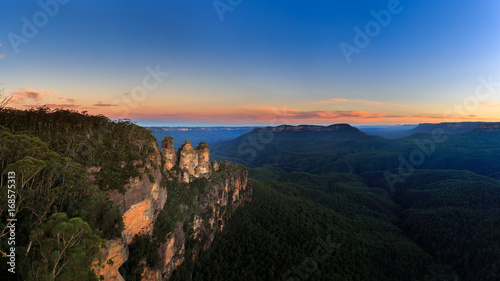 Beautiful View Panorama of the famous Three Sisters rock formation in the Blue Mountains National Park at twilight close to Sydney, Australia