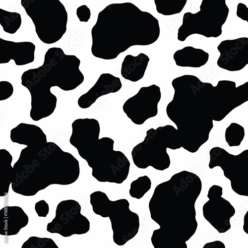 Seamless pattern. Cow or dalmatian. Spots. Black and white.  Animal print, texture. Vector background.