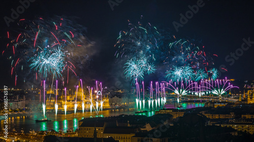 Budapest, Hungary - 20th of August fireworks on St. Stephens or foundation day of Hungary. This view includes the Hungarian Parliament, Liberty Statue, Gellert Hill, Citadell and Chain Bridge © zgphotography
