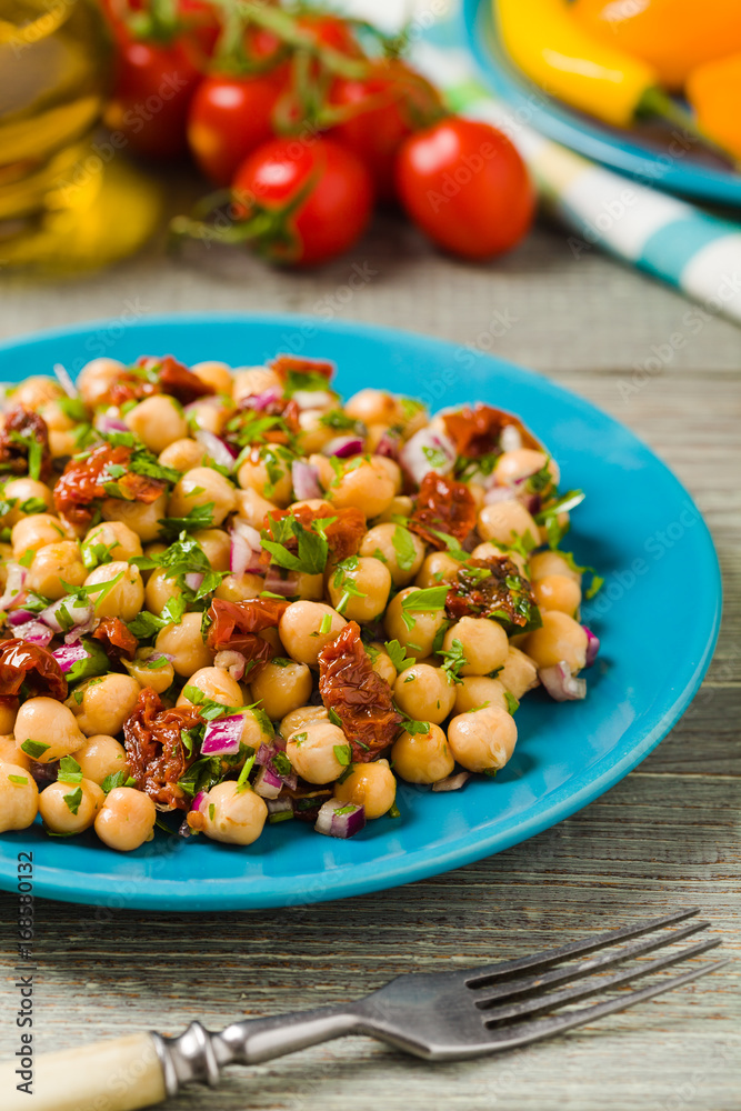 Chickpeas salad with onion and dried tomatoes.