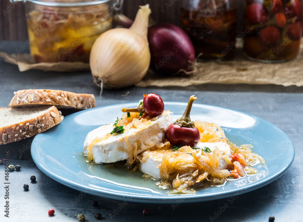 Cheese with white mold Hermelin with onion and hot pepper. Delicious snack