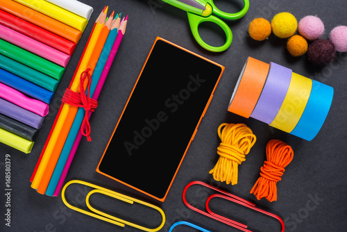 Stationery tools on a black background.