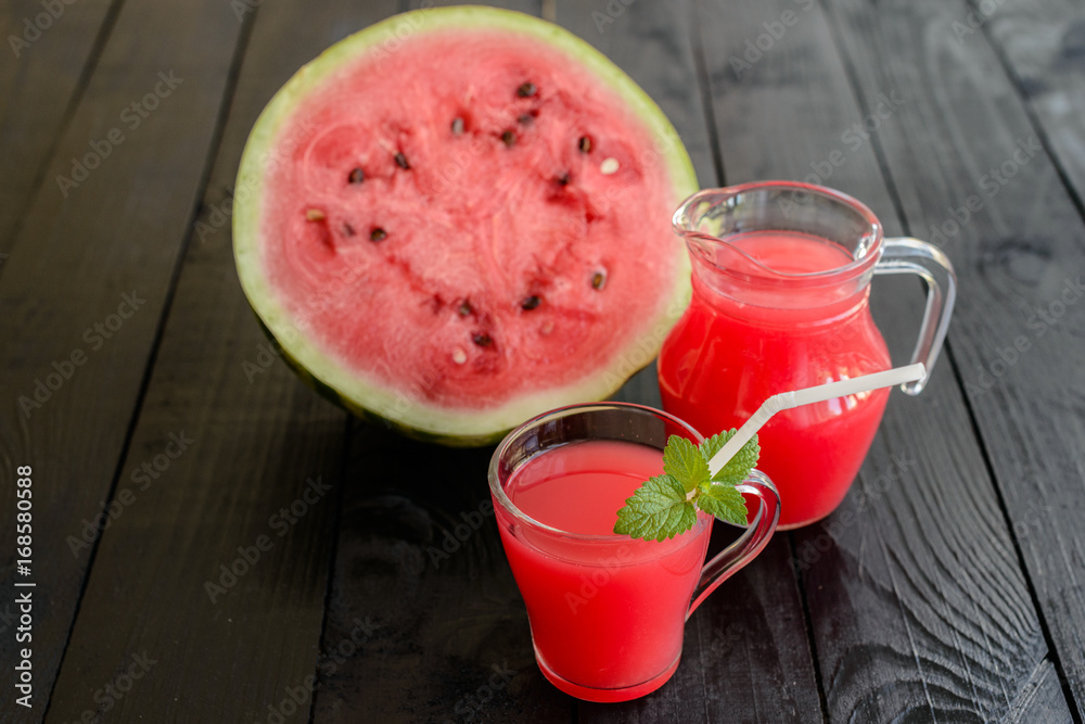 Watermelon juice on a wooden table. It can be used as a background Watermelon juice on a wooden table. It can be used as a background