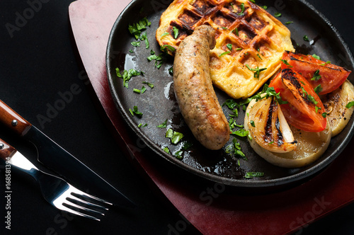 juicy sausage grill on a beautiful pan with vegetables
