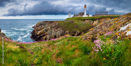 Panorama of lighthouse and ruin of monastery, Pointe de Saint Mathieu, Brittany (Bretagne), France photo