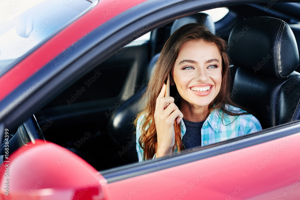Woman talking on phone while driving Woman talking on phone while driving
