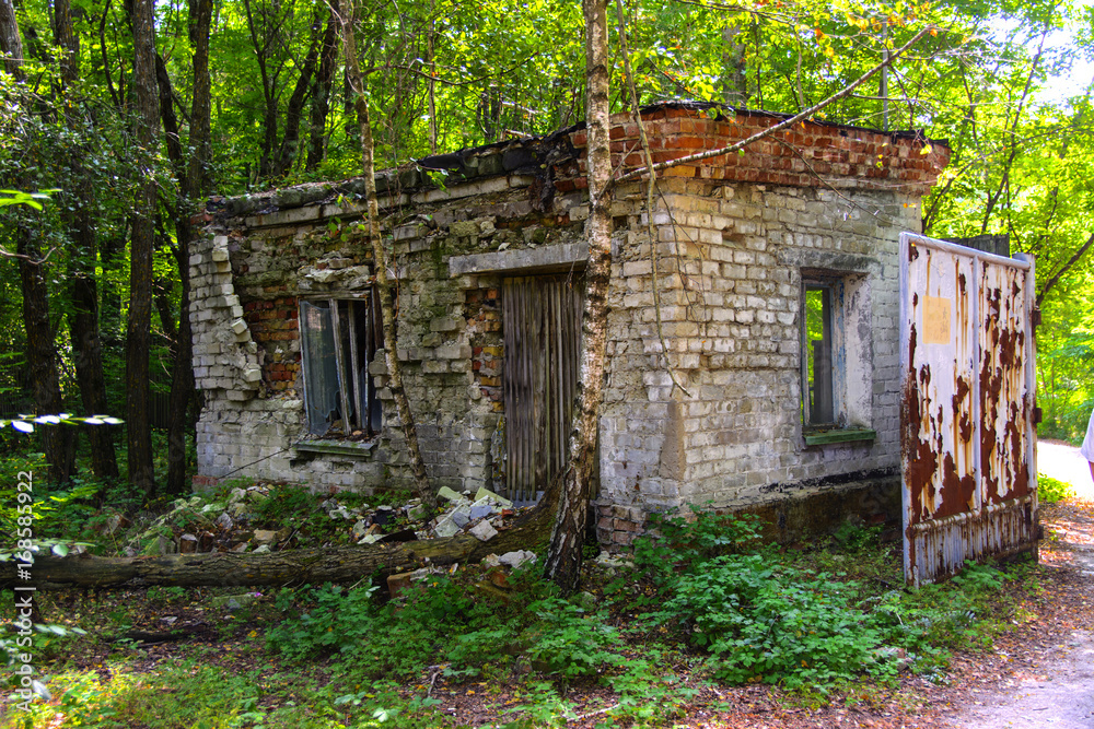 The old abandoned building of the checkpoint. Dead military unit. Consequences of the Chernobyl nuclear disaster, August 2017.