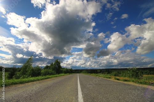 road in the field cloudy landscape