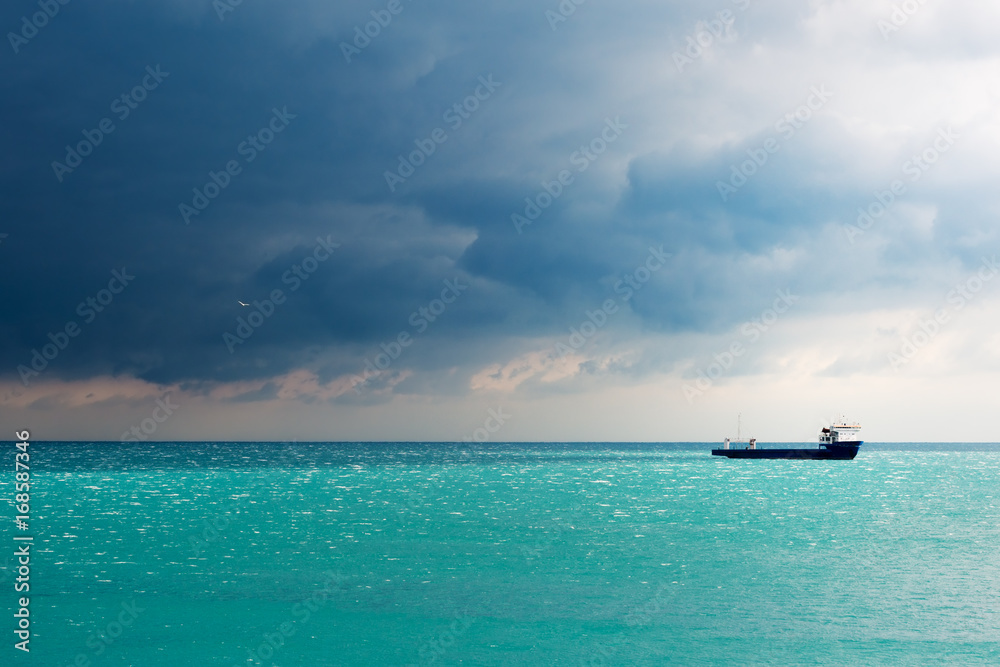 Storm gathering above commercial vessel in Black Sea
