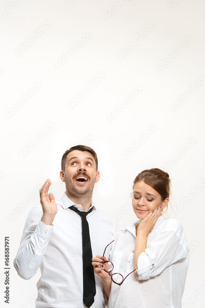 Successful business couple at the office looking up Successful business couple at the office looking up