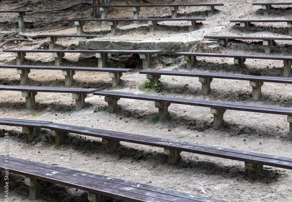 The rows of wooden bench, forest natural theater The rows of wooden bench, forest natural theater