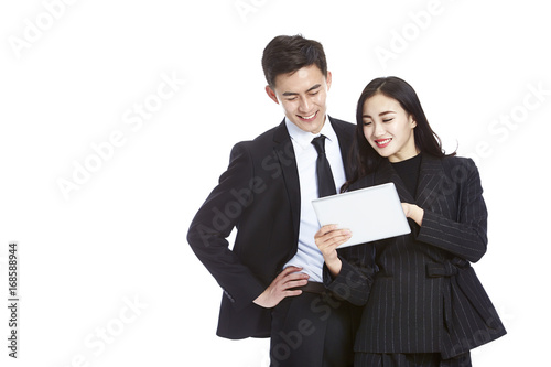 Photography asian business man and woman using digital tablet, isolated on white background