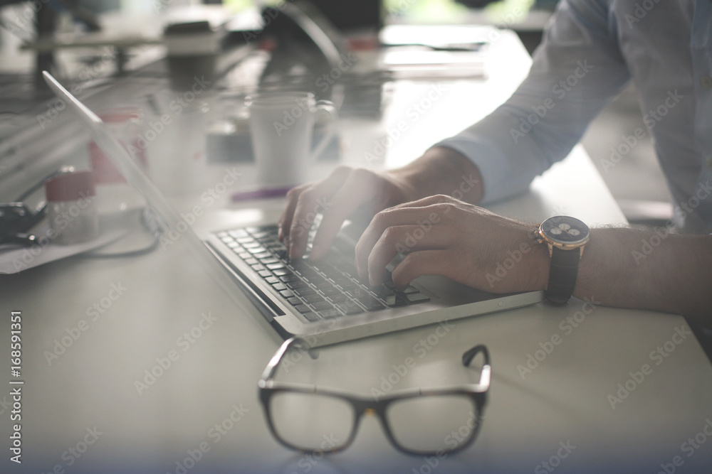 Close up of hand. Business man working on laptop in office. Close up of hand. Business man working on laptop in office.