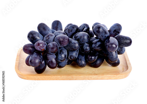 Wallpaper Mural Black grapes  in wood plate on white background Torontodigital.ca