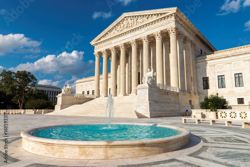 Washington DC, US Supreme Court and fountain at sunset.