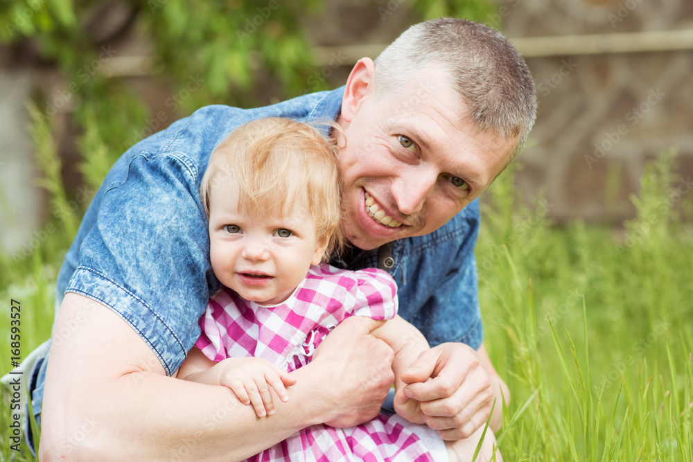 Daddy hugs his little daughter. Family portrait Daddy hugs his little daughter. Family portrait
