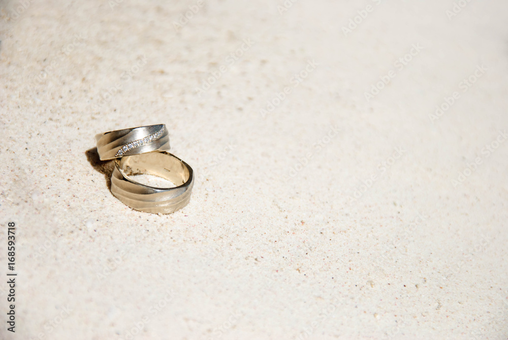 Wedding rings on sand Wedding rings on sand