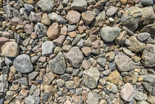 Textures of stones in different colors lying on the ground