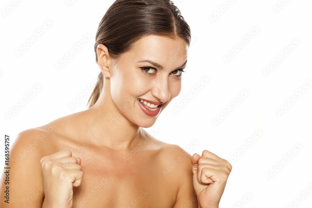 Portrait of happy and satified young woman on white background Portrait of happy and satified young woman on white background