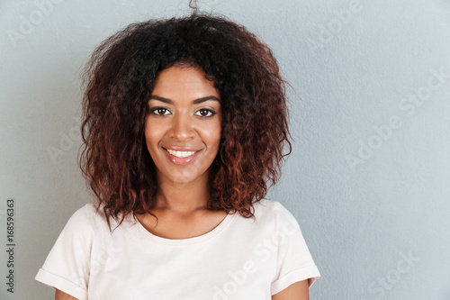 Close up portrait of a smiling casual afro american woman