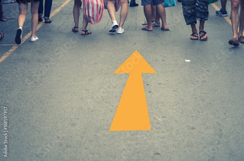 People walking with arrows on the street