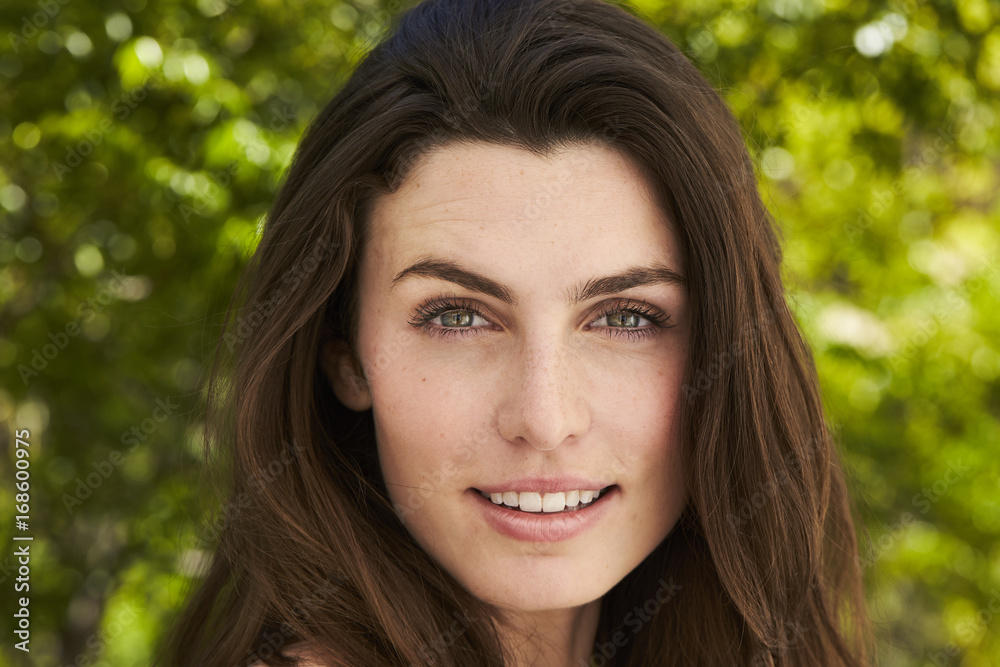 Green eyed and beautiful woman smiling to camera Green eyed and beautiful woman smiling to camera