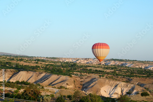 ballooning. Bright multicolored balloon against the blue sky